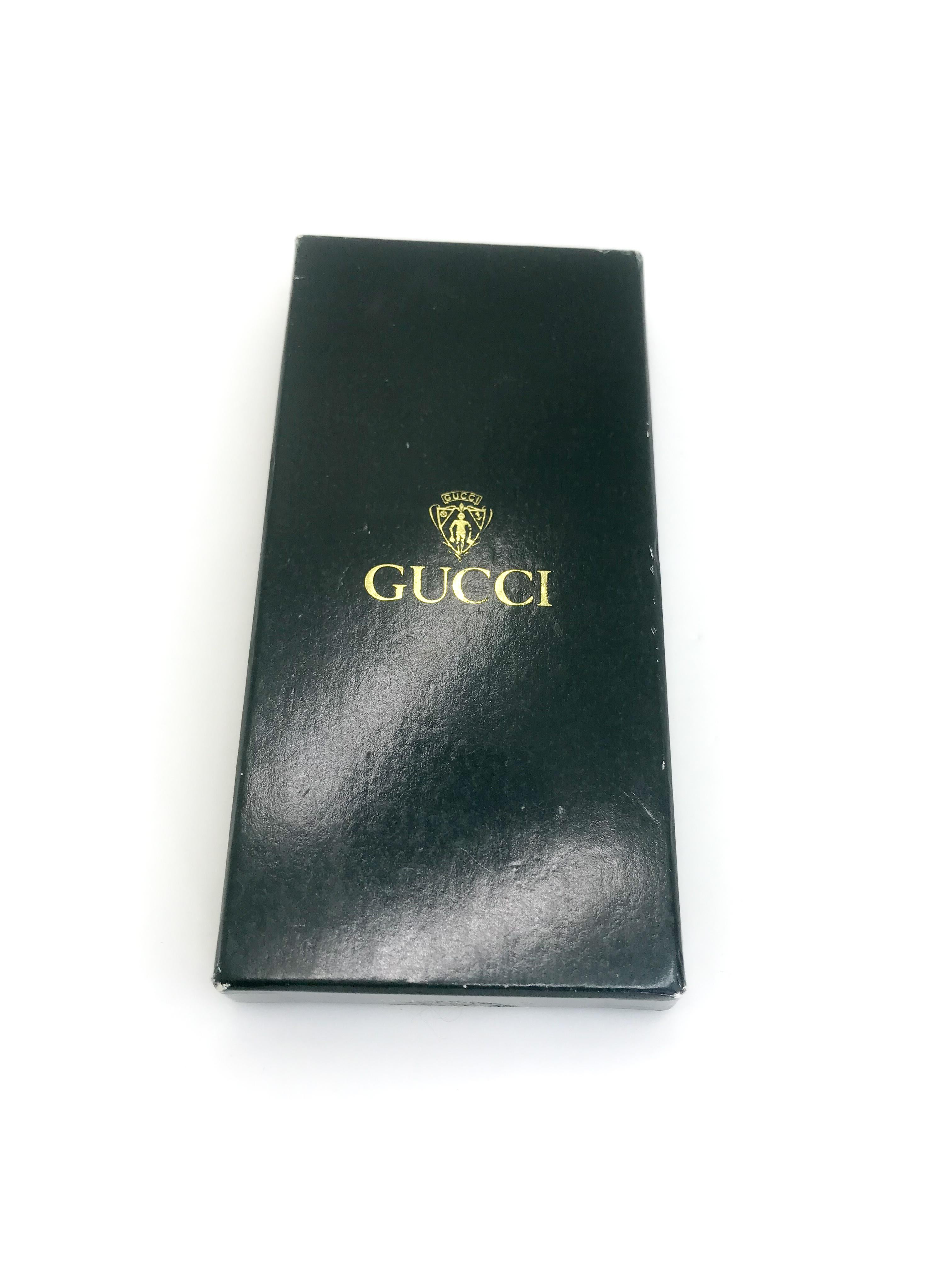 Gucci 1970s Vintage Keyring.   Unworn with original box.  Still with tag!.

Stamped made in Italy on reverse.

This is a rare find.  A true Gucci lovers collectors piece.

Pretty much mint condition overall.  A very minor green mark on front of