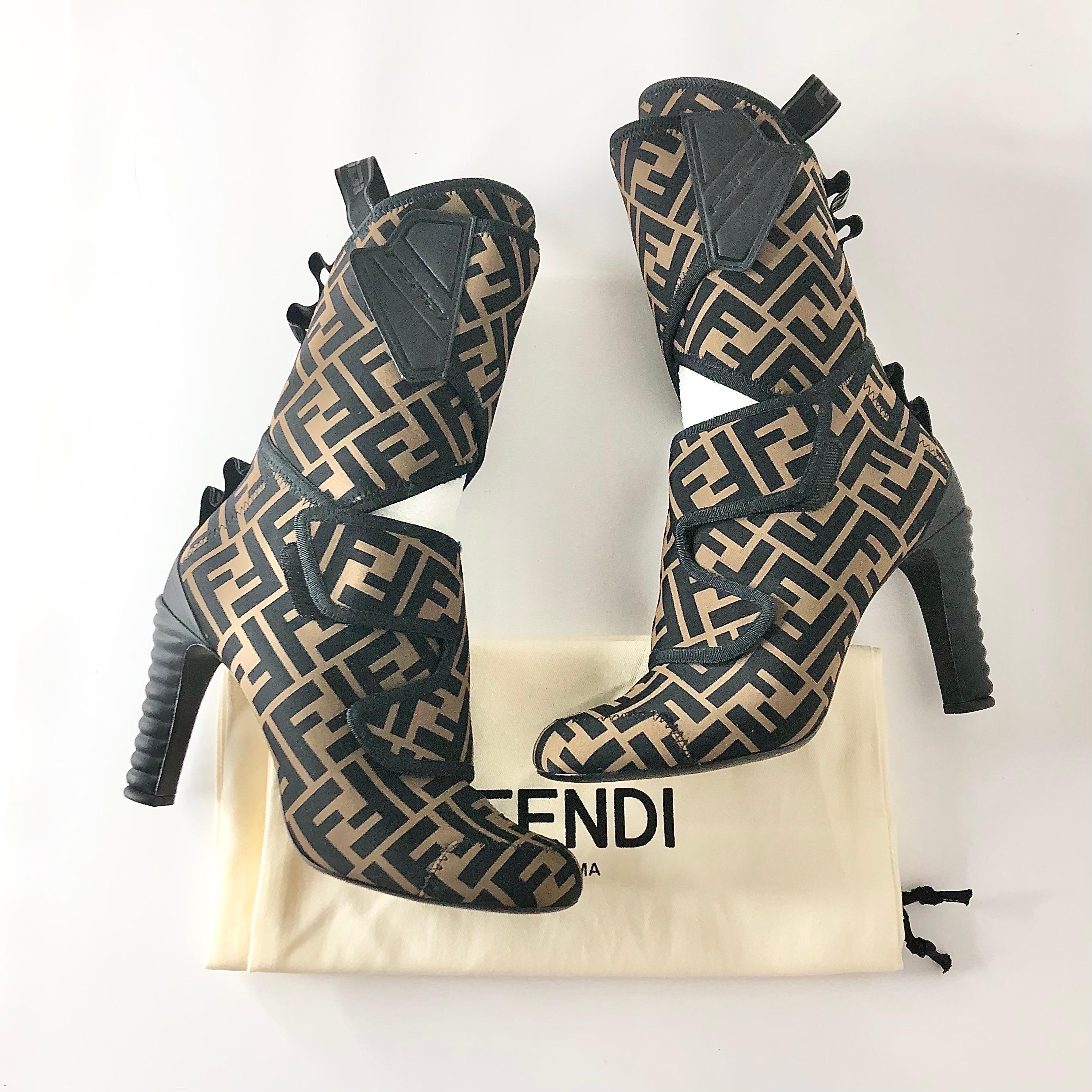 Fendi FF Logo Mid Length High Heeled Boots
With dustbags 
Color Tobacco Black
Size 38EU
Lycra upper
Rubber sole
Hook and look wrap closure
Zucca monogram print
Signs of normal use, overall good preowned condition 

ff, luxury, lux, authentic, real,