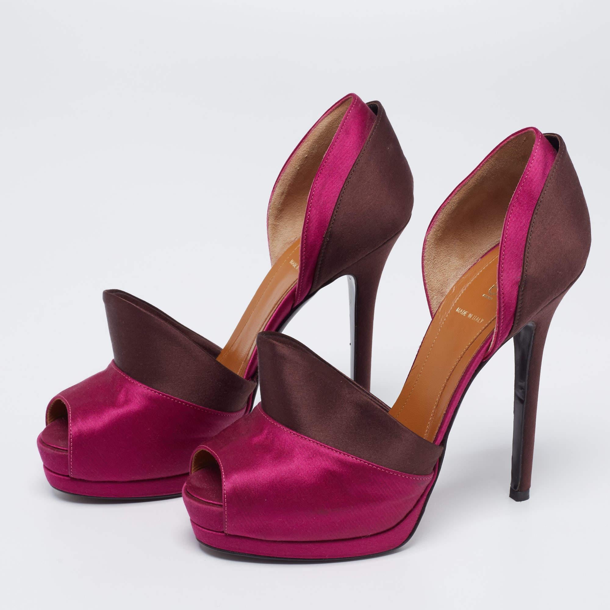 The expertly placed d'Orsay cut serves as a striking element of this pair of Fendi pumps. Created from satin into a peep-toe silhouette, it is elegantly raised on 13.5cm heels and features leather insoles, a wide panel on the vamps, and covered-up