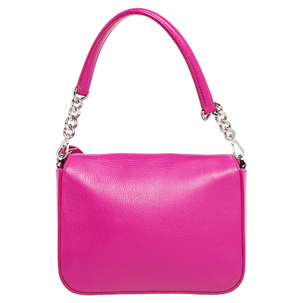 The Fendi Baguette is one of the most-coveted bags among all the fashionistas. Made from leather, the magenta-colored creation has the FF logo on the flap and includes a single handle and a shoulder strap. It looks beautiful with its silver-tone