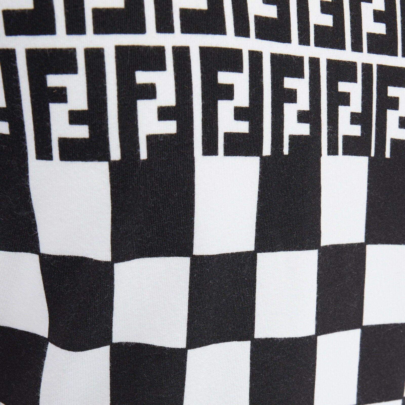 FENDI MAGLIA Zucca FF monogram black white checker print t-shirt top S

FENDI MAGLIA
Cotton, elastane.Black white printed. Signature FF monogram printed at top with checkerboard checks printed at body. V-neck. Short sleeve. Contrast white stitching.