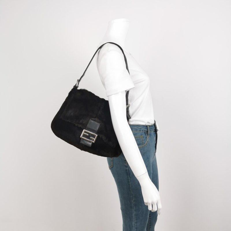 Fendi Mamma Baguette Black Faux Fur Shoulder Bag
 These are professional photos of the actual bag.
 This Fendi Baguette is both a handbag and a plush toy. Its touch is soft and it is highly lovable, making this piece extra special.
 CONDITION: GOOD
