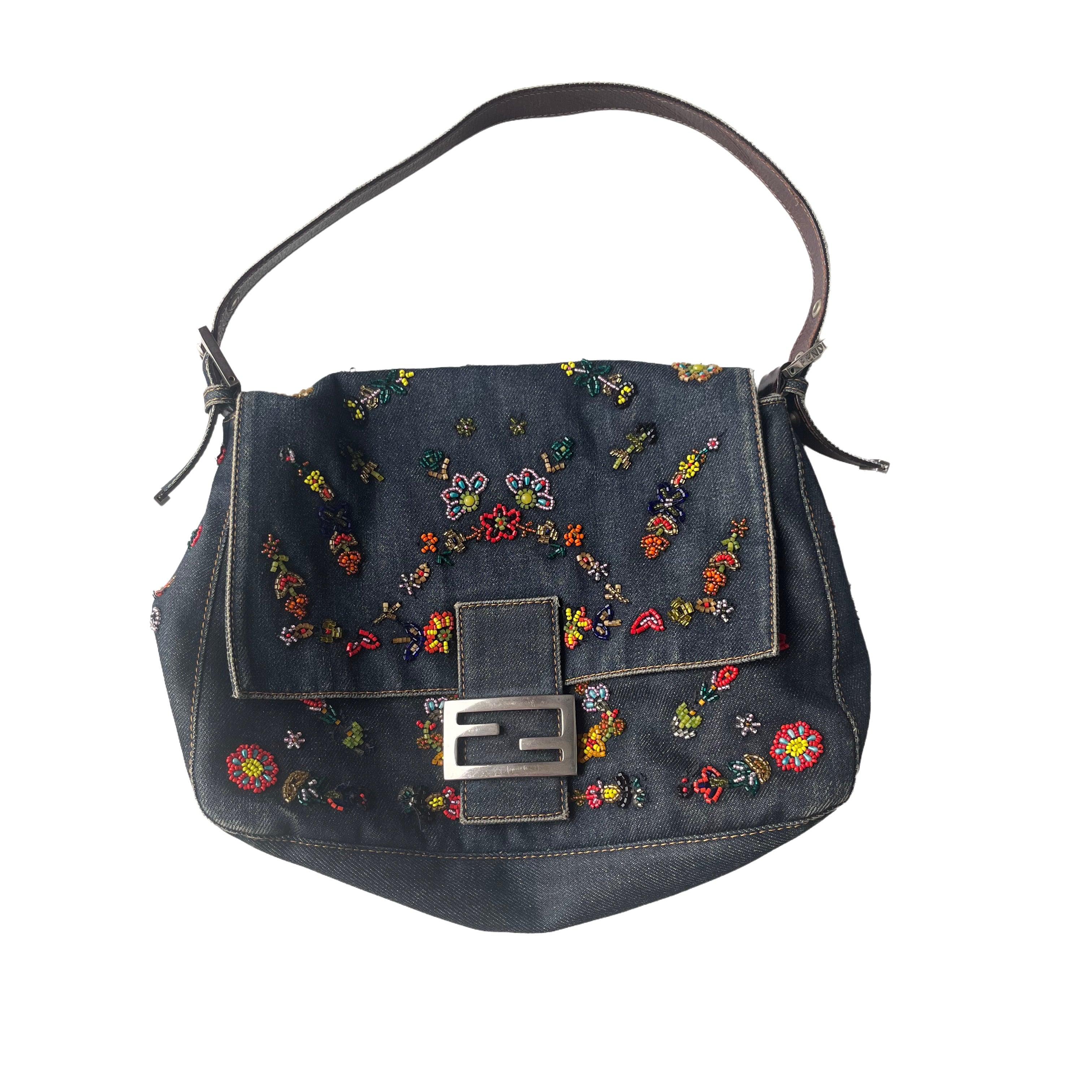 FENDI Mamma Baguette Blue Denim with Floral Beads These are professional photos of the actual bag offered by Luxbags. Vintage Fendi Mamma Baguette in Blue Denim With beaded Flower embroidery, removable leather strap, silk yellow lining. One of the