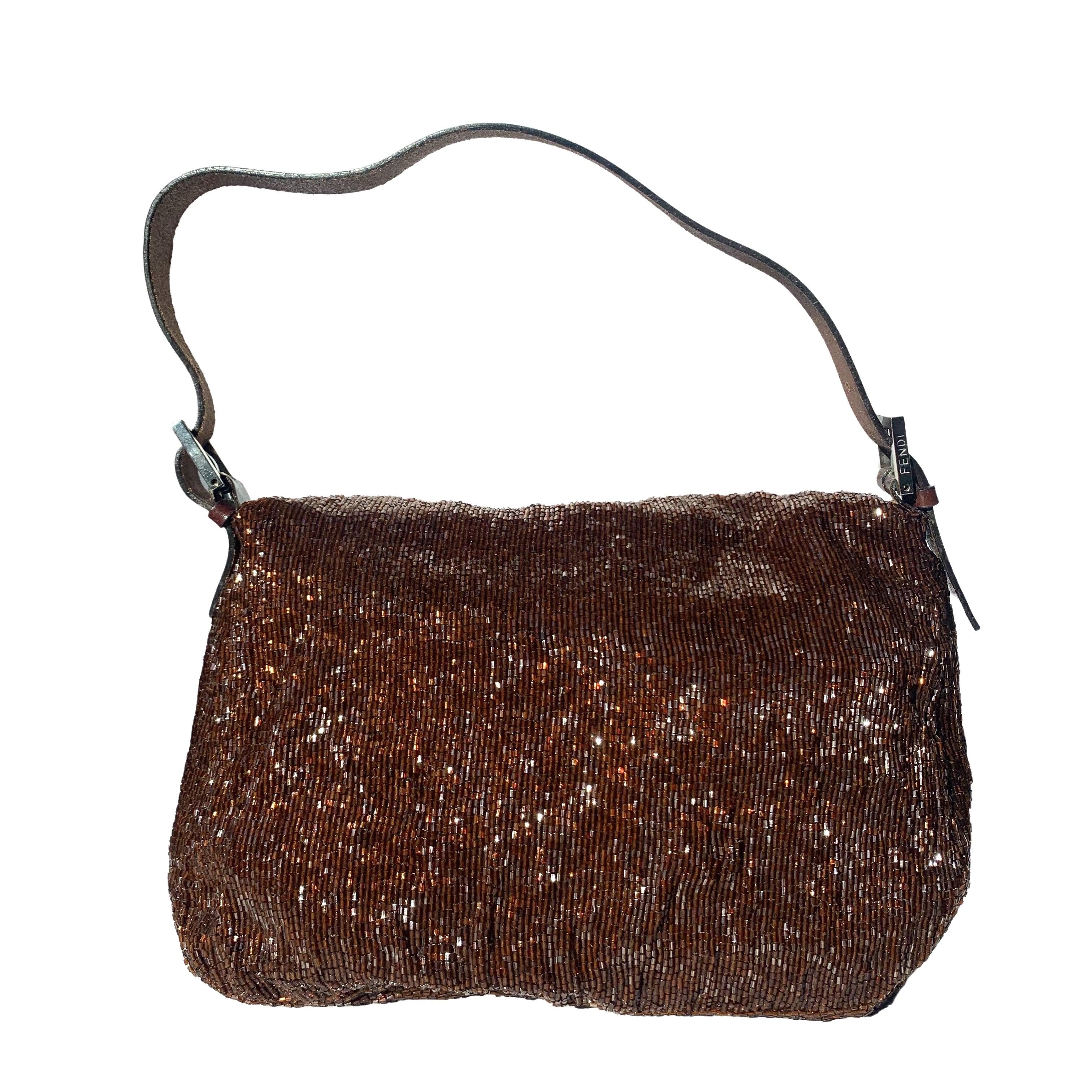 Fendi Mamma Baguette Brown Beaded Shoulder Bag
 These are professional photos of the actual bag offered by Luxbags.
 
 This Fendi Mamma Baguette in Chocolate Brown Beads is a great winter accessory that is both glamorous and practical. ;In Very good