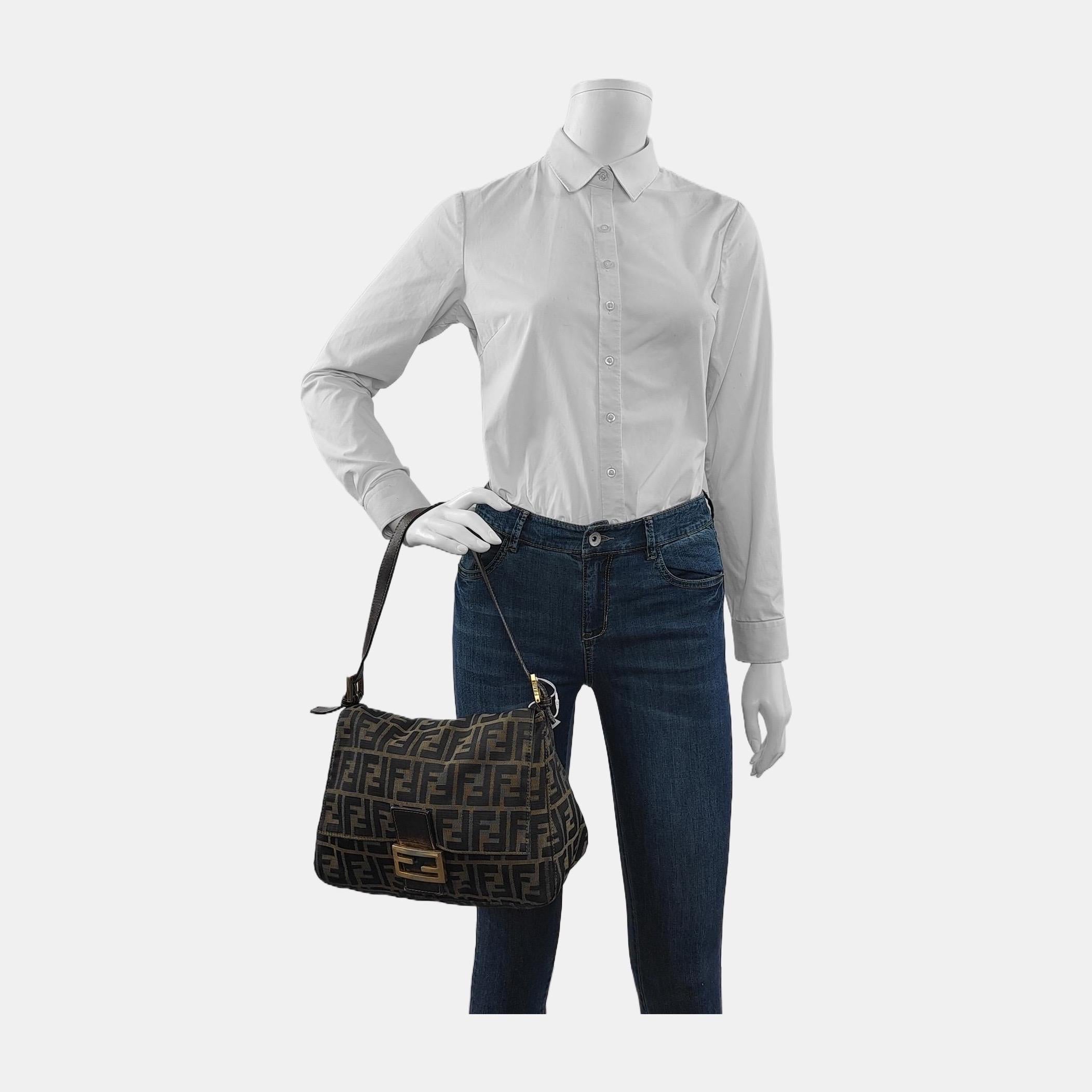 Fendi Mamma Baguette Brown Classic Zucca Monogram These are professional photos of the actual bag offered by Luxbags. Introducing the Fendi Baguette, a classic icon featuring the beloved Zucca print. This vintage brown shoulder bag is a must-have