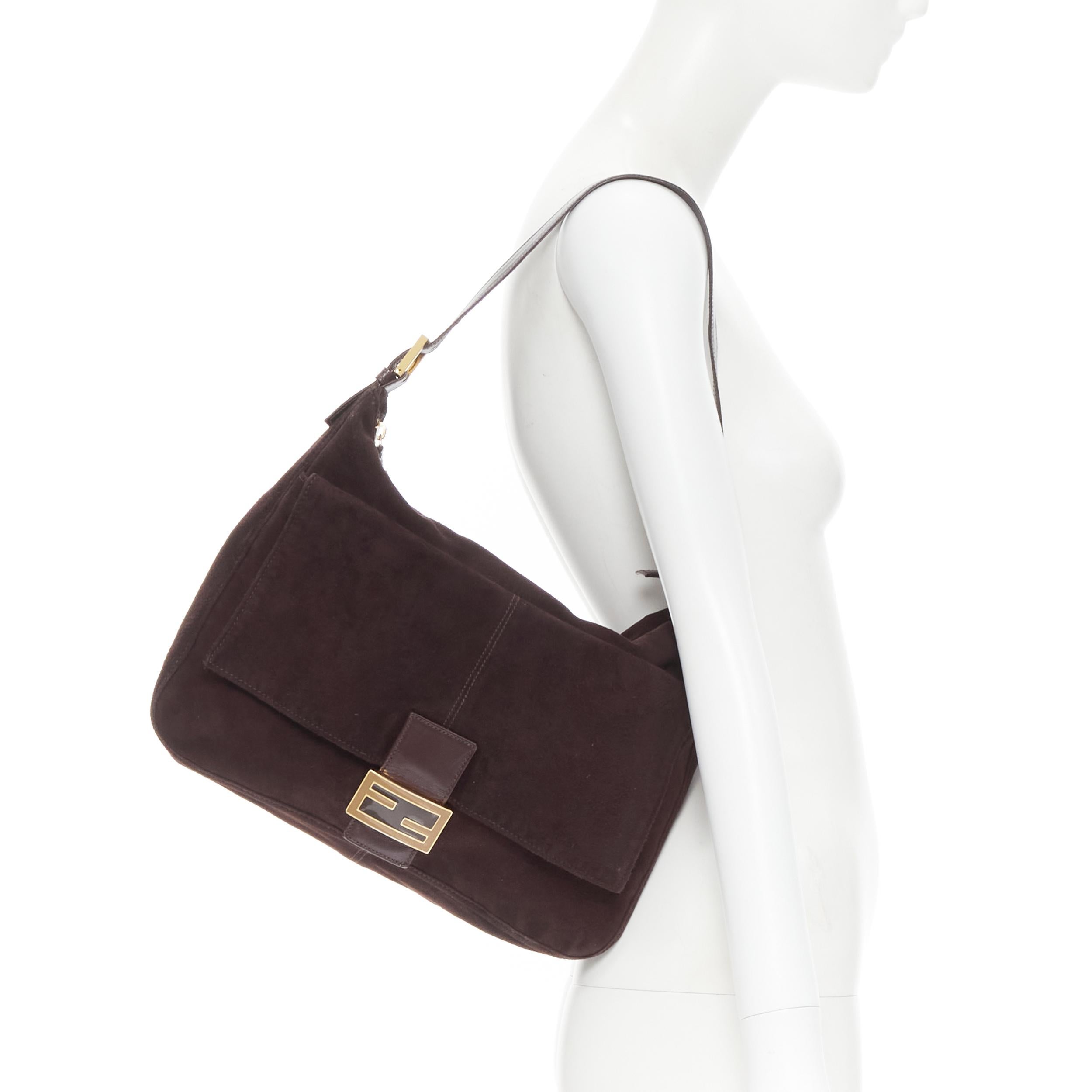 FENDI Mamma Baguette brown suede brown enamel FF buckle flap shoulder bag 
Reference: GIYG/A00094 
Brand: Fendi 
Model: Mamma Baguette 
Material: Suede 
Color: Brown 
Pattern: Solid 
Closure: Zip Extra 
Detail: Mamma Baguette. Dark brown suede