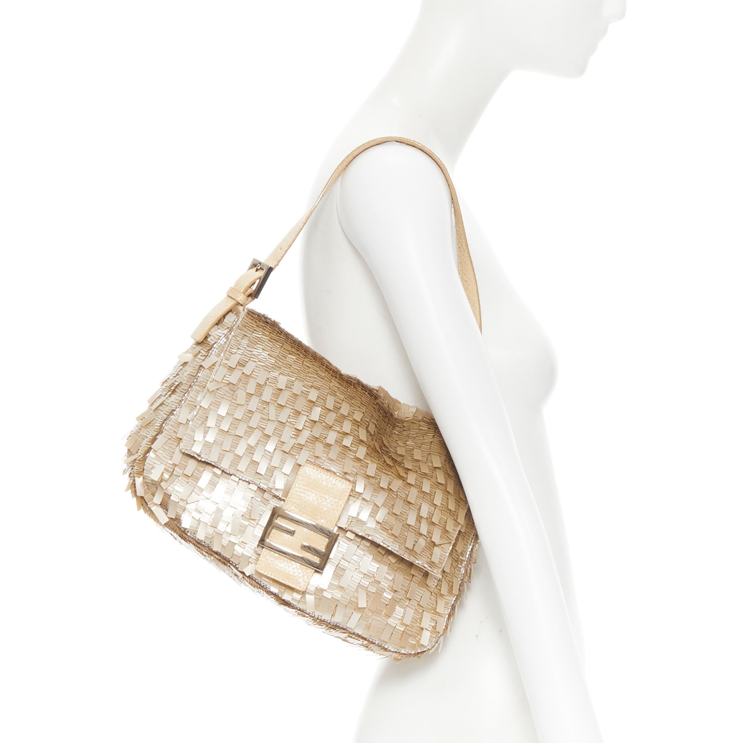 FENDI Mamma Baguette gold sequins scaled leather FF zucca buckle shoulder bag
Reference: GIYG/A00093
Brand: Fendi 
Model: Mamma Baguette Sequins
Material: Sequins
Color: Gold
Pattern: Solid
Closure: Magnet
Extra Detail: Mamma Baguette. Sequins