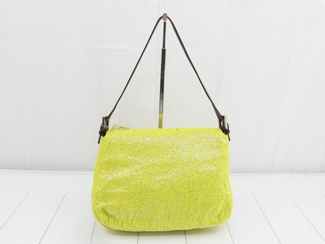 Fendi Mamma Baguette Lemon Yellow Beaded Shoulder Bag
 These are professional photos of the actual bag offered by Luxbags.
 
 This Fendi Mamma Baguette in bright Lemon Yellow Beads is a great spring/summer accessory that is both glamorous and