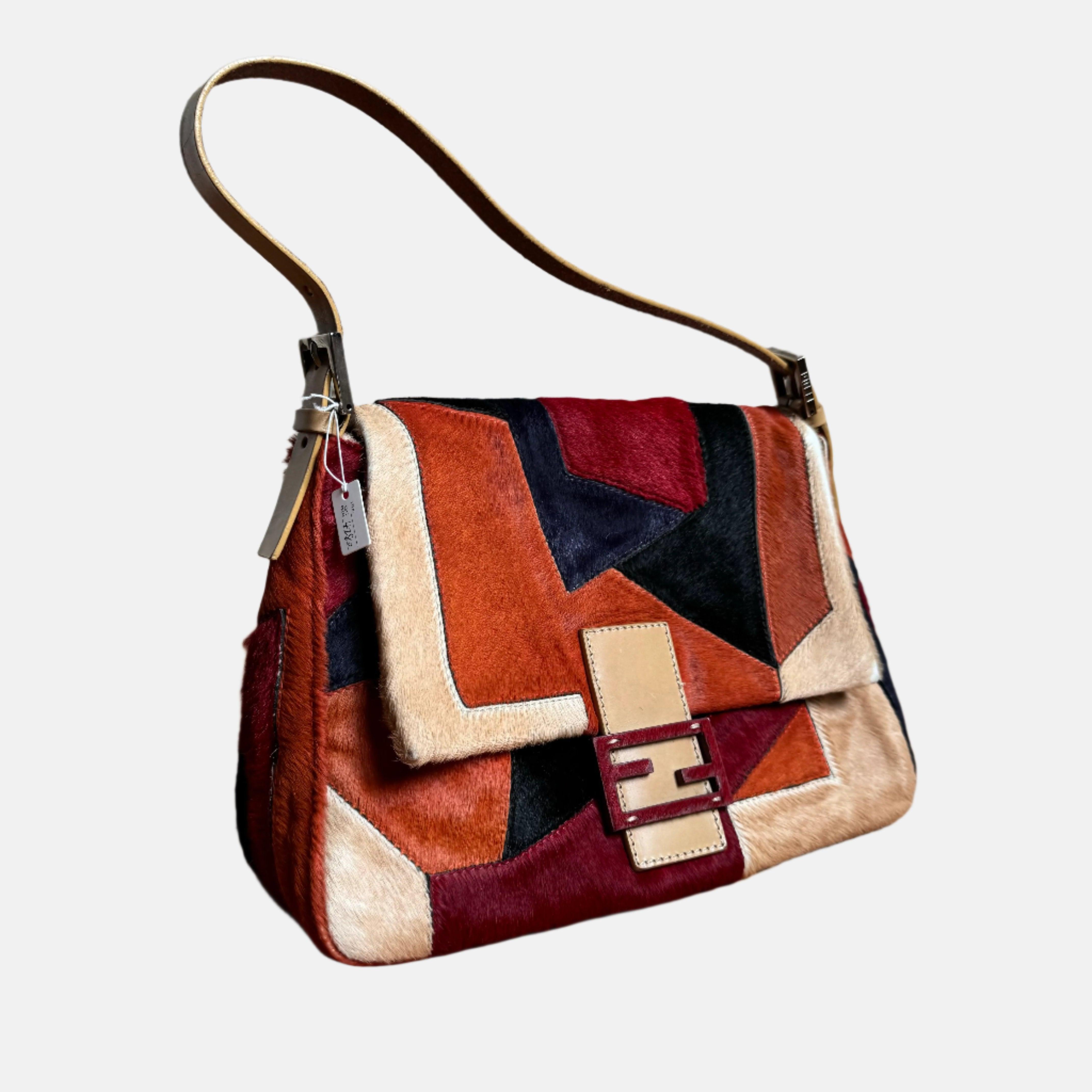 Fendi Mamma Baguette Multicolor Pony-style Calfskin Leather Abstract Block Pattern
 These are professional photos of the actual bag offered 
 CONDITION: VERY GOOD
 Moderate sense of use throughout. Rubbing and bare parts around the corners and edges