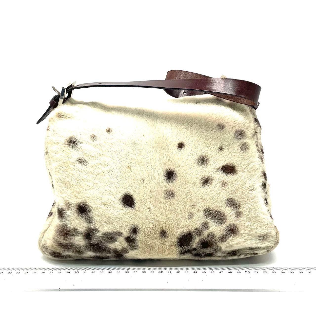 Fendi Mamma Baguette Pony-style Calfskin Dalmatian Dog Polka Dots Print
 These are professional photos of the actual bag.
 CONDITION: VERY GOOD
 Moderate sense of use throughout. Rubbing and bare parts around the corners and edges of the flap. The