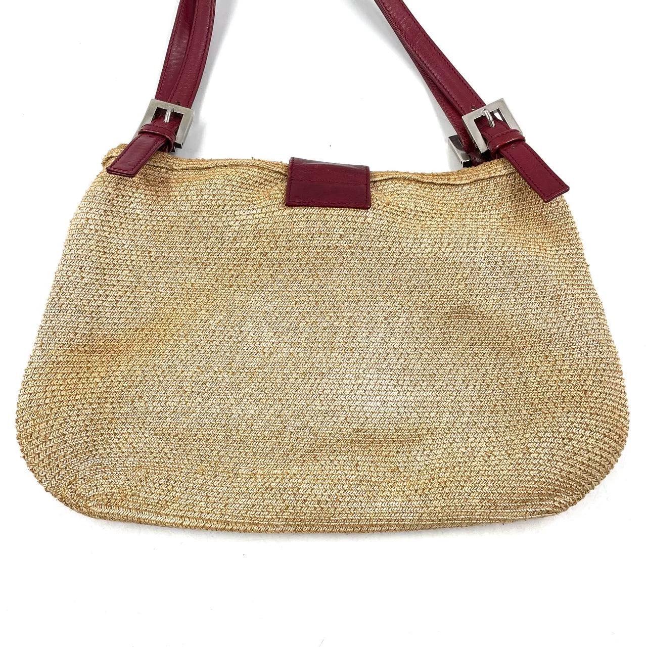 Fendi Mamma Baguette Raffia Straw Shoulder Bag Red Leather Strap
  These are professional photos of the actual bag offered by Luxbags.
  
  This Fendi Baguette is made from Raffia material that‚Äôs similar to straw but softer and stronger. It is