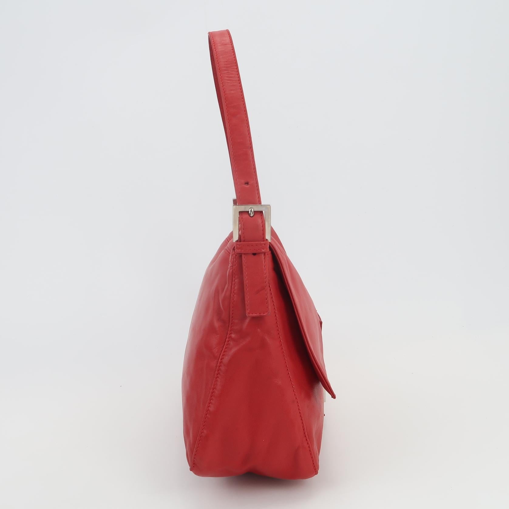 Fendi Mamma Baguette Red Lambskin Leather Silver Hardware
These are professional photos of the actual bag offered by Luxbags.
This exquisite Fendi Mamma Baguette is expertly crafted from premium lambskin leather, providing a luxuriously soft and