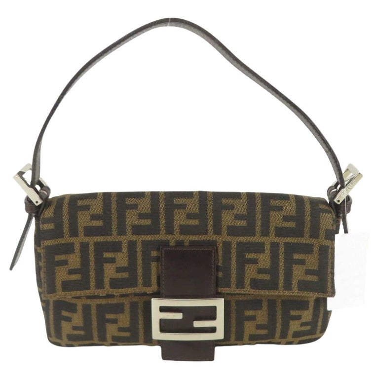 Fendi Mamma Baguette shoulder bag is made from dark brown Zucca canvas ...