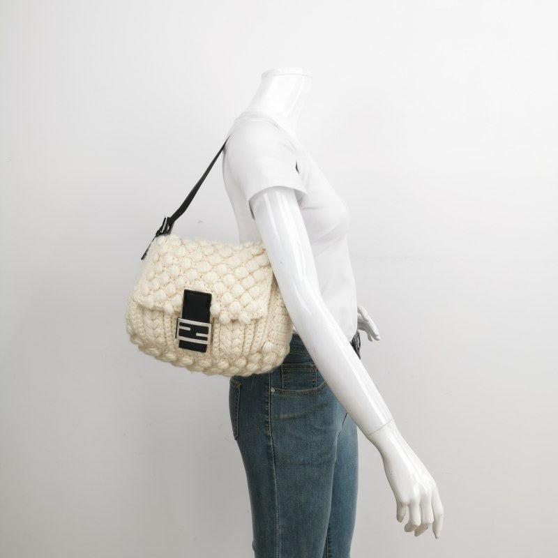 Fendi Mamma Baguette White Crochet Pompom Shoulder Bag
 These are professional photos of the actual bag.
 This Fendi Baguette in white wool with pompoms are super cute. It‚Äôs a great winter accessory. 
 CONDITION: Very good condition
 Light signs