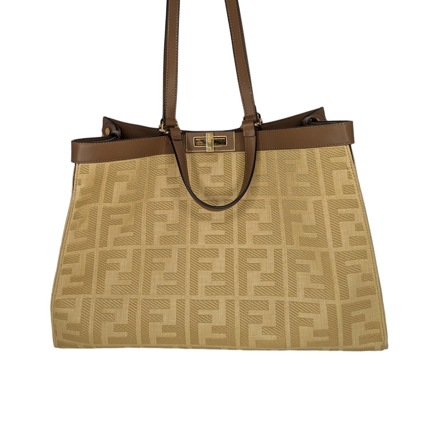 Medium X-Tote bag made of beige canvas with a tone on tone raised embroidery FF motif. Trimmed in brown leather and decorated with the classic twist lock. Unlined interior featuring a pocket with a press-stud fastening and gold-finish metalware.