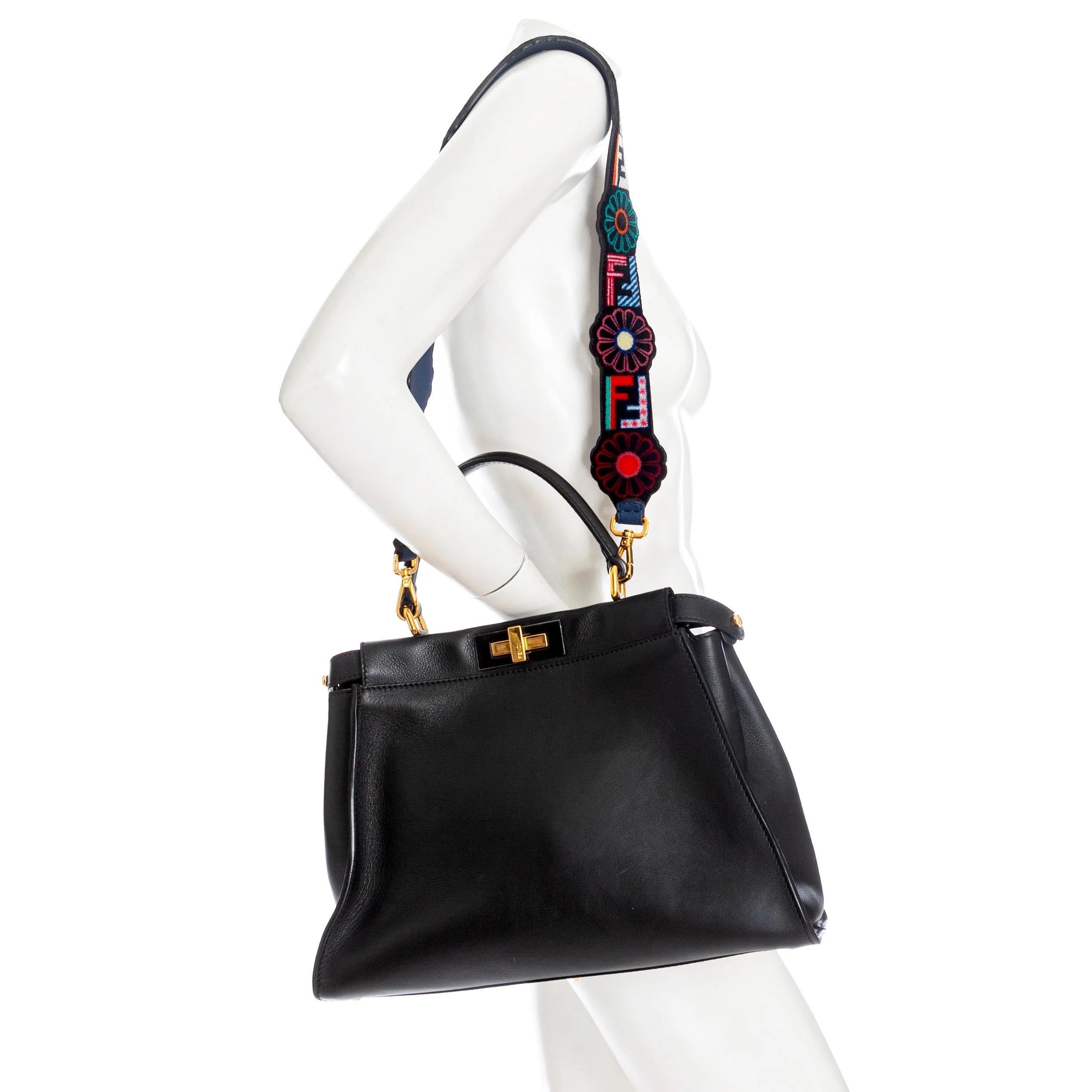 Fendi Medium Peekaboo Black Leather Floral Strap Two-Way Bag

2017
Black Leather Peekaboo Bag
Strap You Logo And Flower-print Velvet Bag Strap
Gold-tone hardware
Symmetrical front and back construction
Rolled top handle
Turn-lock closure
Prong tabs