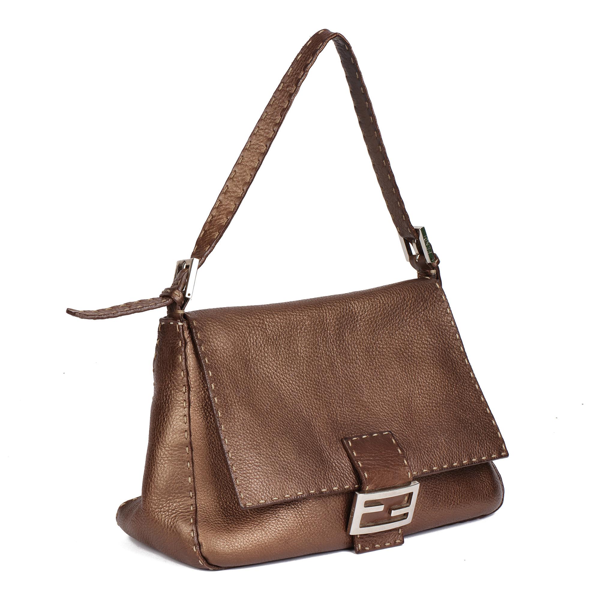 FENDI
Metallic Brown Calfskin Leather Mama Baguette

Serial Number: 2172.SE (unreadable)
Age (Circa): 2000
Authenticity Details: Date Stamp (Made in Italy)
Gender: Ladies
Type: Top Handle, Shoulder

Colour: Bronze
Hardware: Silver
Material(s):