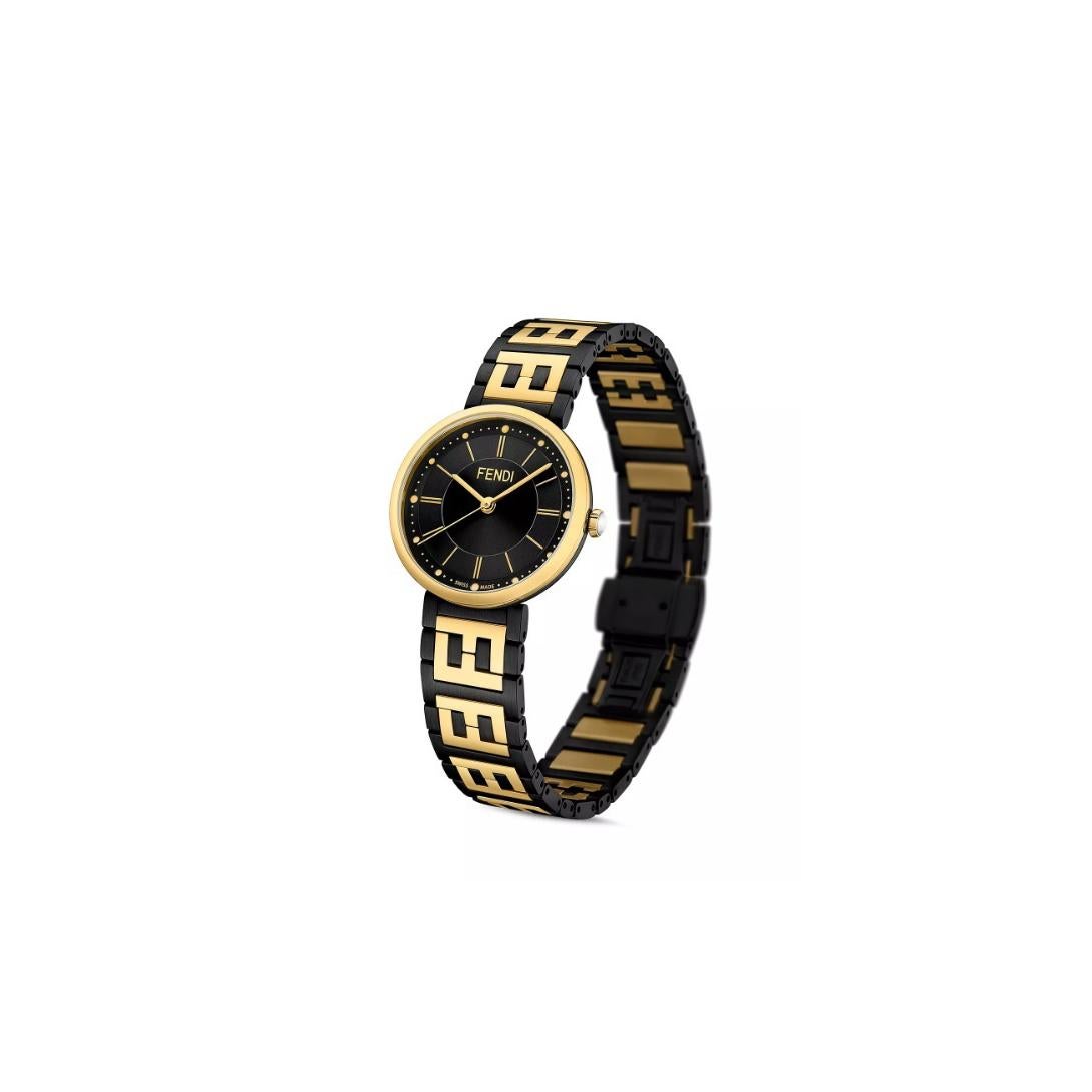 FENDI METALLIC RUN AWAY WATCH F711034000C0
Forever Fendi Collection.

-Stainless steel
-Movement: Quartz
-Case size: 29 mm
-Black dial
-FF logo patter on the bracelet
-Water proof: 5ATM

Comes with Box & Papers
*Original Retail: $1,375