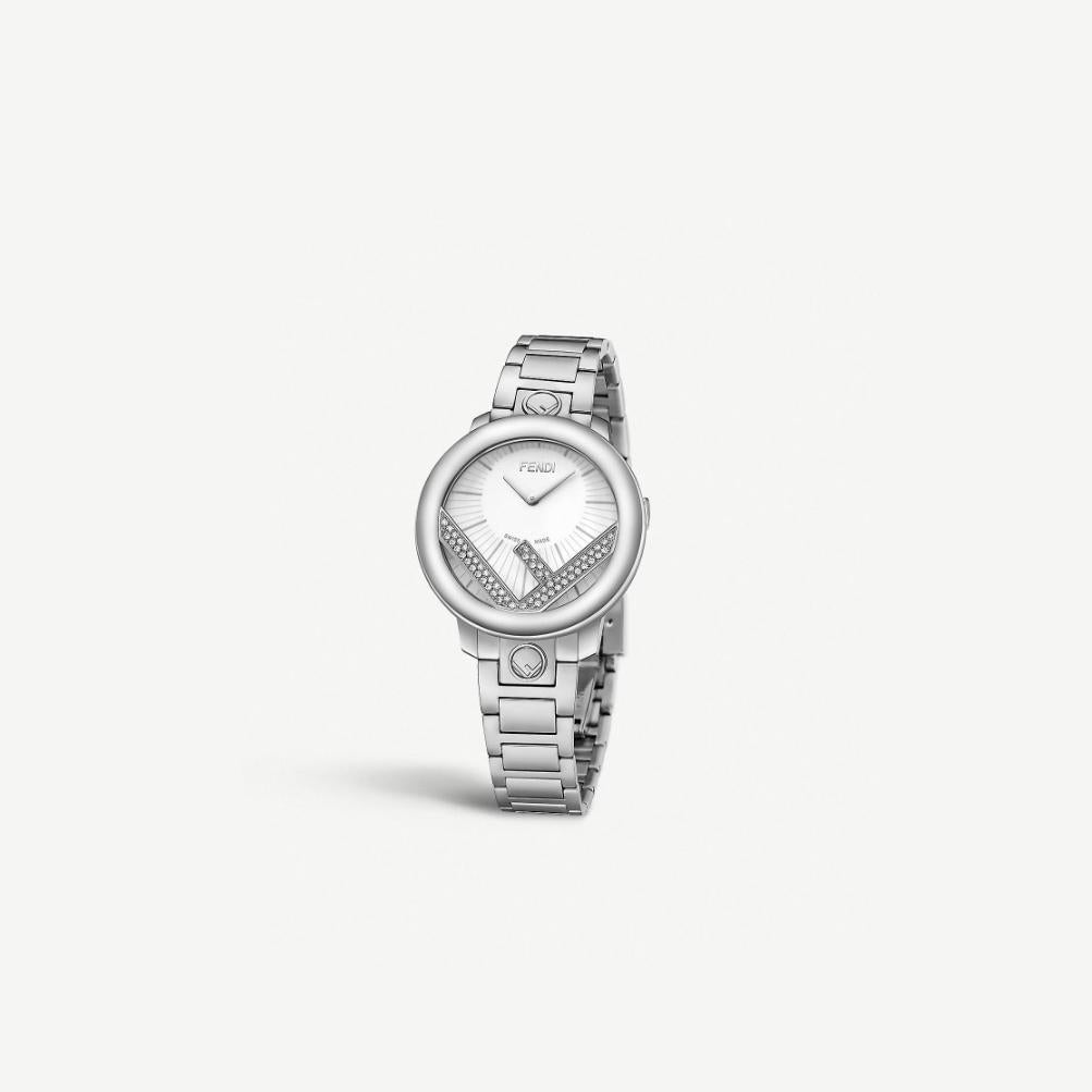 FENDI METALLIC RUN AWAY WATCH F711034000C0
Forever Fendi Collection.

-Stainless steel
-Movement: Quartz 
-Case size: 36 mm
-Fifty-nine 0.29 carat diamonds
-White-silver-tone opalin dial
-'F' motif at 12 and 6 o'clock 
-Water proof: 5ATM

Comes with