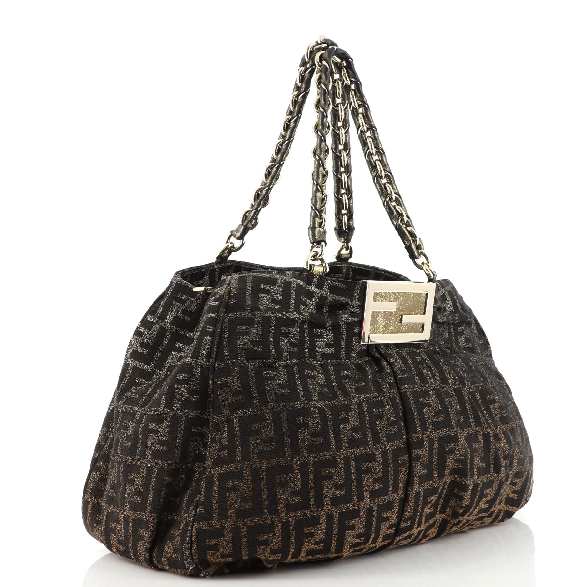 Condition: Very good. Odor in interior. Creasing on exterior, wear and fraying on exterior edges, moderate wear and darkening on handles. Light wear in interior, scratches, discoloration and tarnish on hardware.
Accessories: No