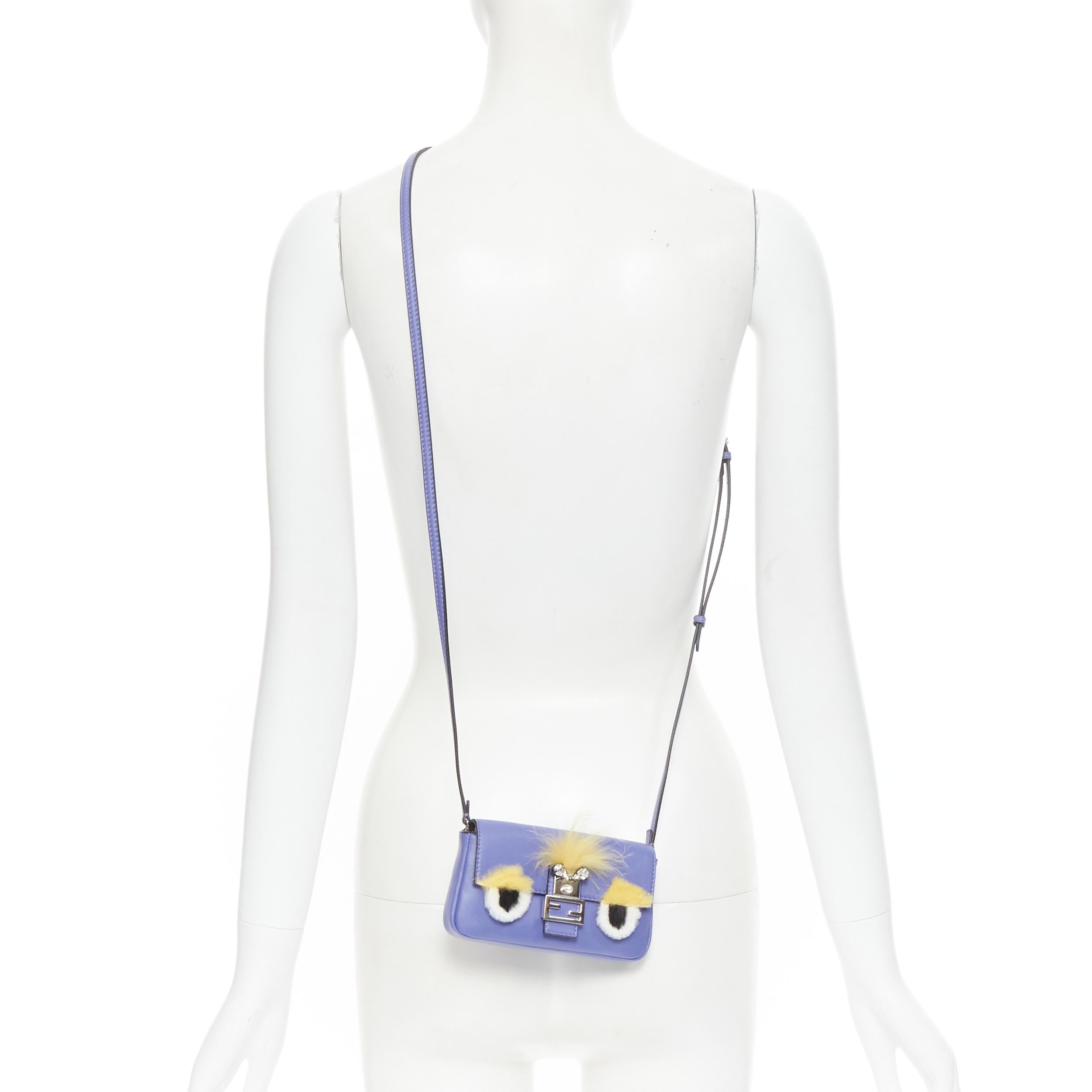FENDI Micro Baguette Monster Bug furry eye crystal FF flap purple crossbody bag 
Reference: TGAS/B01637
Brand: Fendi 
Model: Micro Baguette Buggie bag 
Material: Leather 
Color: Blue 
Pattern: Solid 
Closure: Magnet 
Extra Detail: Blue/purple