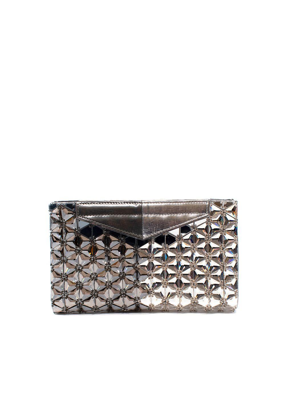 Fendi Mirrored Metallic Leather Clutch Bag

- Mirrored bicolour mosaic with small beads scattered in between
- Bicolour silver and gunmetal leather frame
- Magnetic closure
- Two open pockets
- Suede lined

Materials:
Leather

Made in Italy

9.5