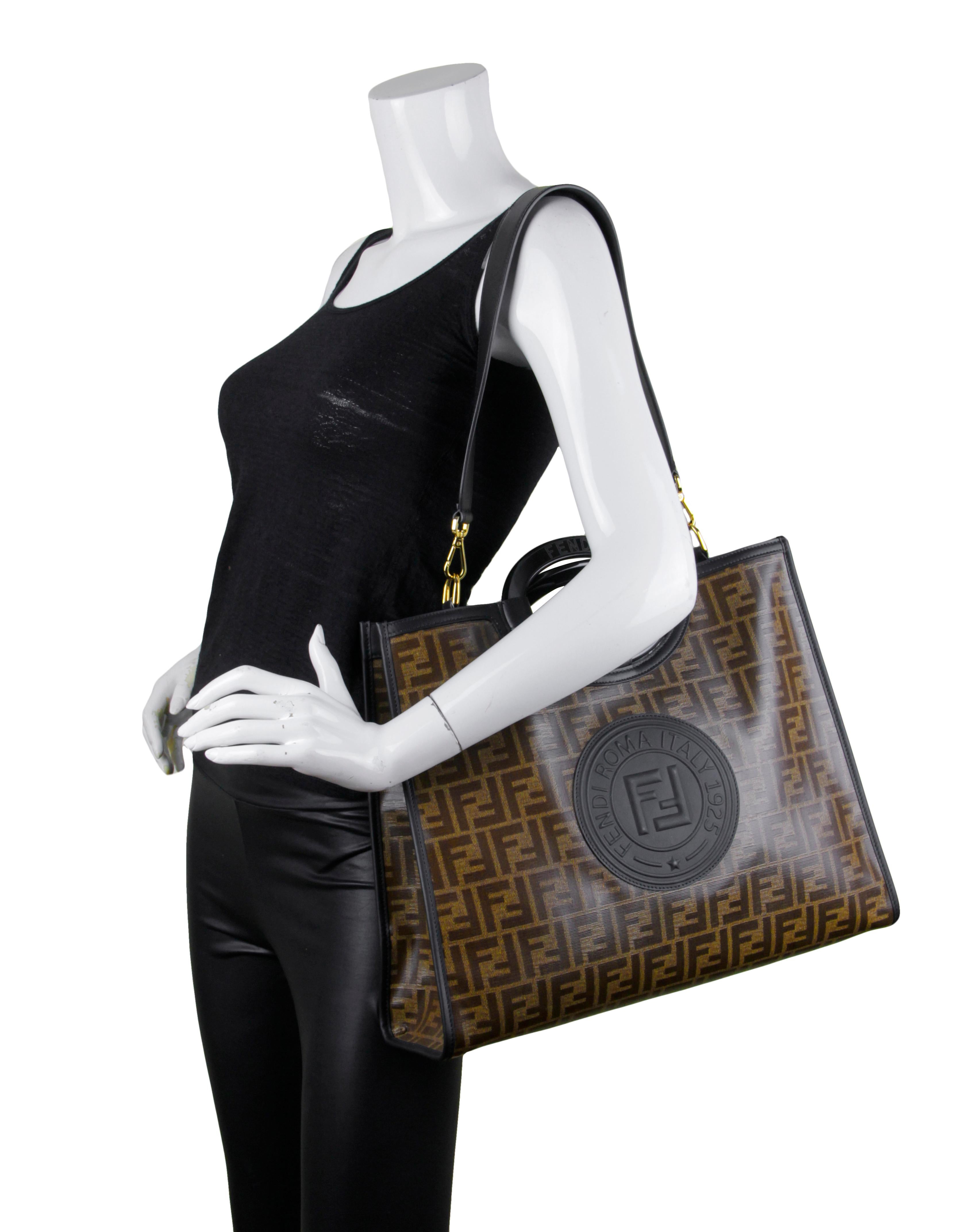 Fendi Mogano Panna Black Glazed Fabric Monogram FF 1974 Stamp Patch Medium Runaway Shopper Tote

Made In: Italy
Color: Brown and black
Hardware: Goldtone
Materials: Glazed fabric and resin with leather strap 
Closure/Opening: Open top
Interior