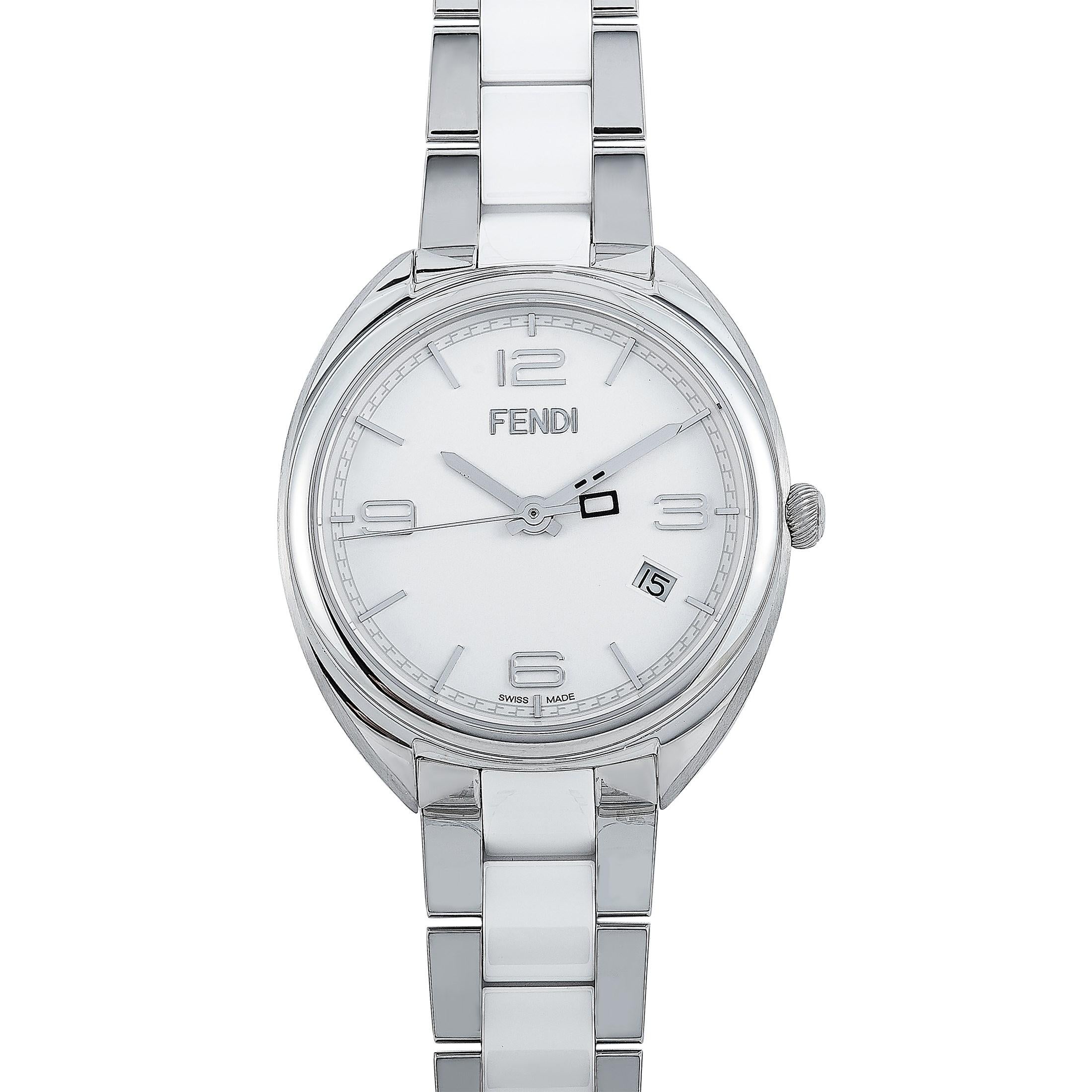 This is the Fendi Momento watch, reference number F211034004.

It is presented with a 34 mm stainless steel case that offers water resistance of 100 meters. The watch is worn on a stainless steel and white ceramic bracelet. The white dial with four