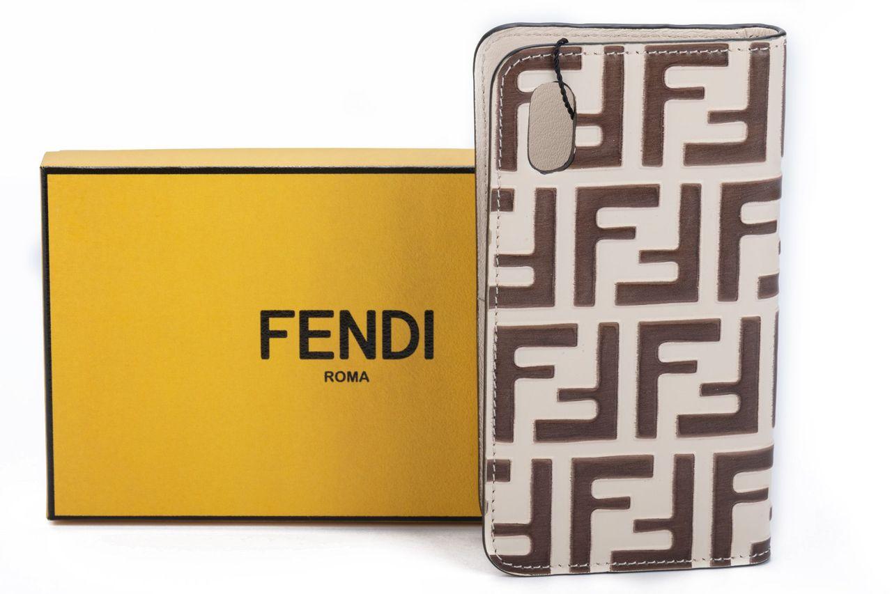 Fendi monogram phone case in cream with brown F logos on it. It fits an Iphone. The item is new and comes with a box, dustcover, booklet and tag.
