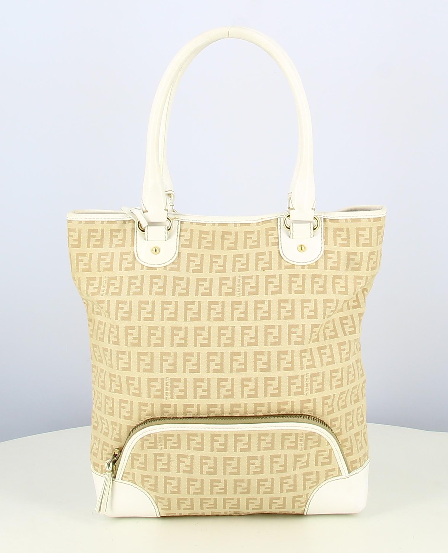 Fendi Monogram Beige And White Handbag

- Good condition It shows signs of wear over time. 
- Fendi Handbag 
- Beige double F monogram
- White leather hanse
- Small zipped front pocket
- Interior: Beige fabric plus small inside pocket 
- Clasp :