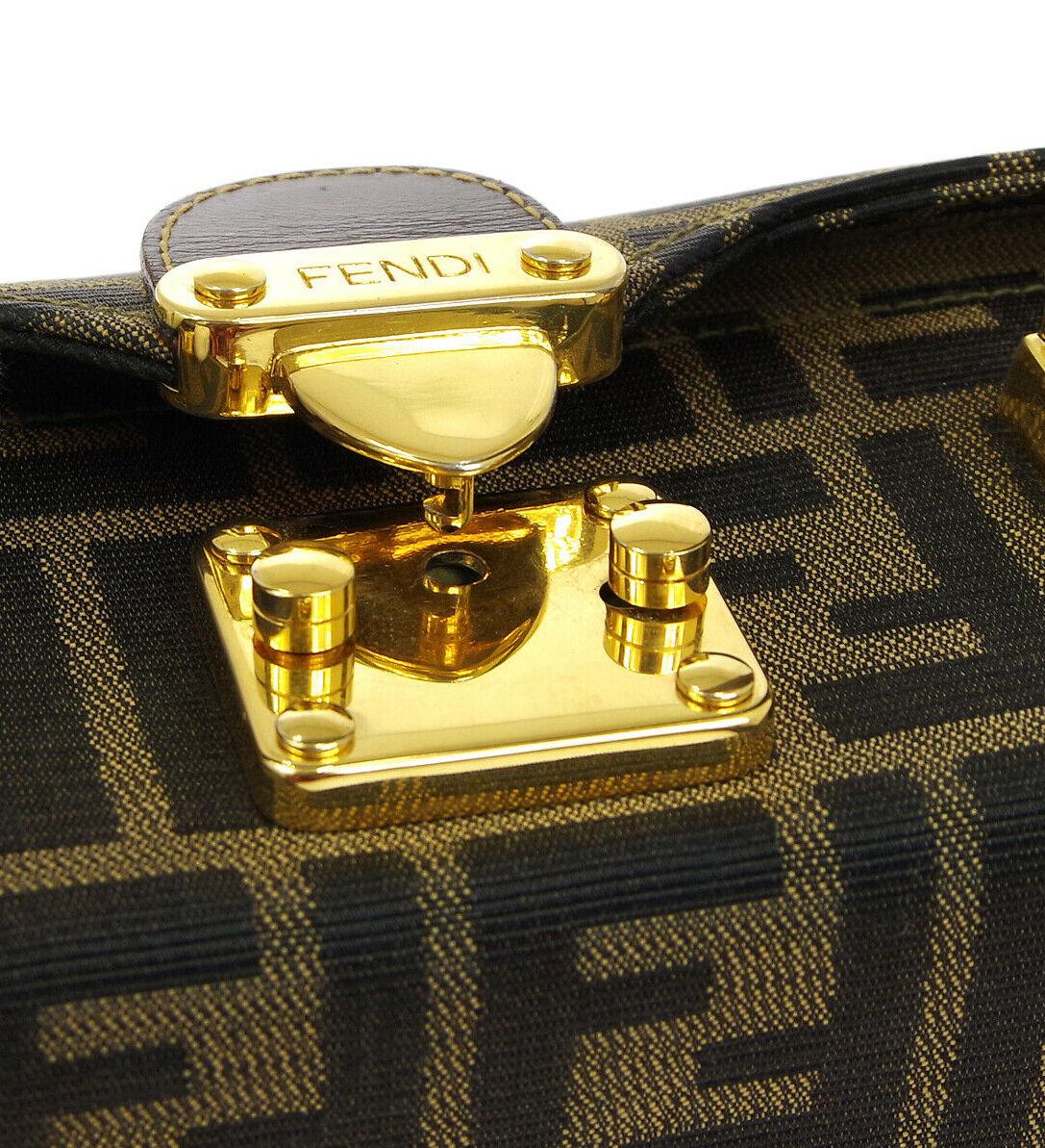 Fendi Monogram Canvas Box 2 in 1 Small Mini Top Handle Satchel Evening Shoulder Bag

Canvas
Leather
Metal
Gold tone hardware
Flip lock closure
Handle drop 4