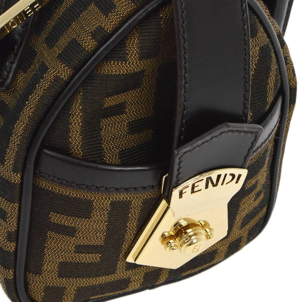 Fendi Monogram Logo Black Evening Speedy Style Top Handle Satchel Bag

Monogram canvas
Leather trim
Gold tone hardware
Woven lining
Made in Italy
Handle drop 3