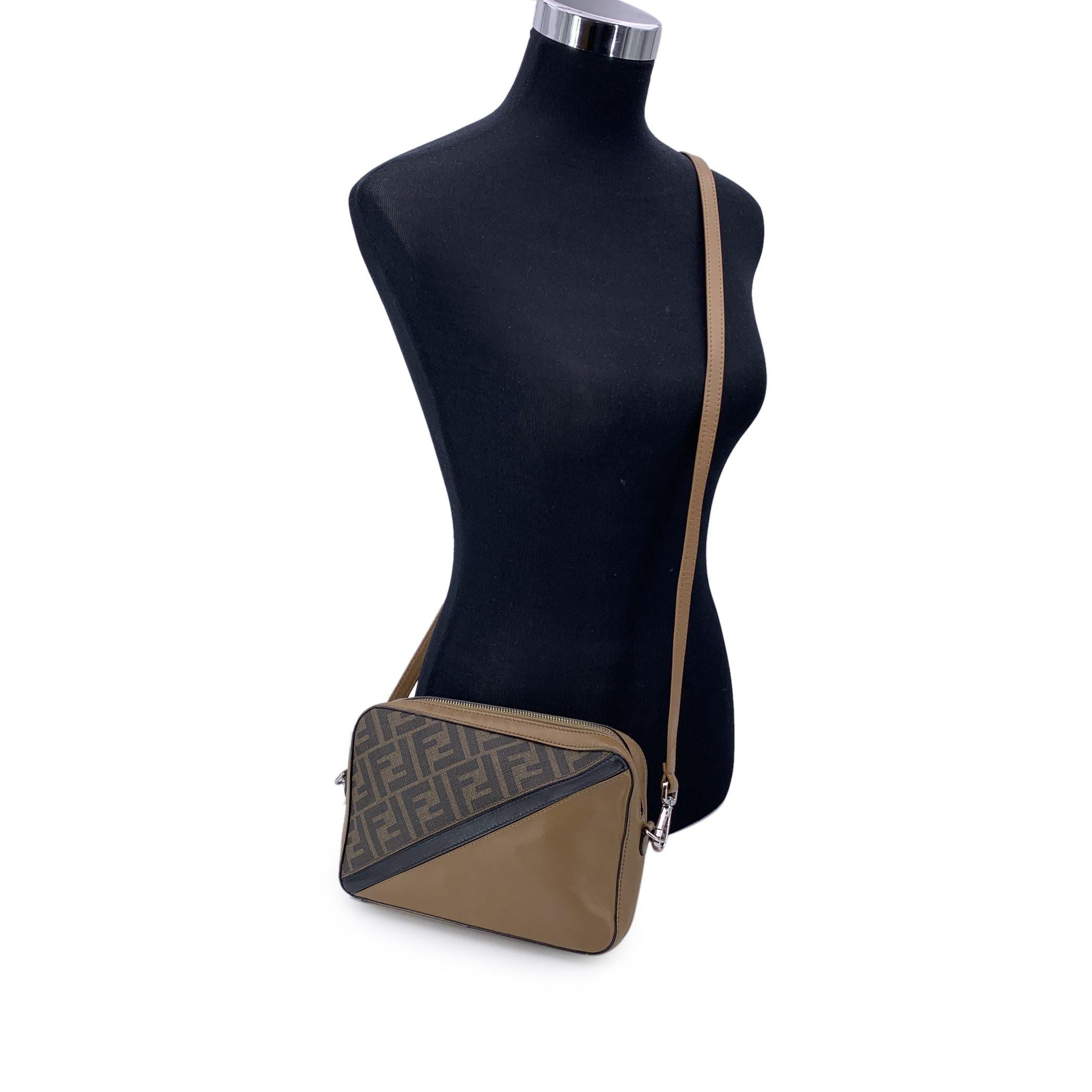 This beautiful Bag will come with a Certificate of Authenticity provided by Entrupy. The certificate will be provided at no further cost Step into timeless sophistication with the Fendi Diagonal Camera Crossbody bag, a perfect blend of practicality