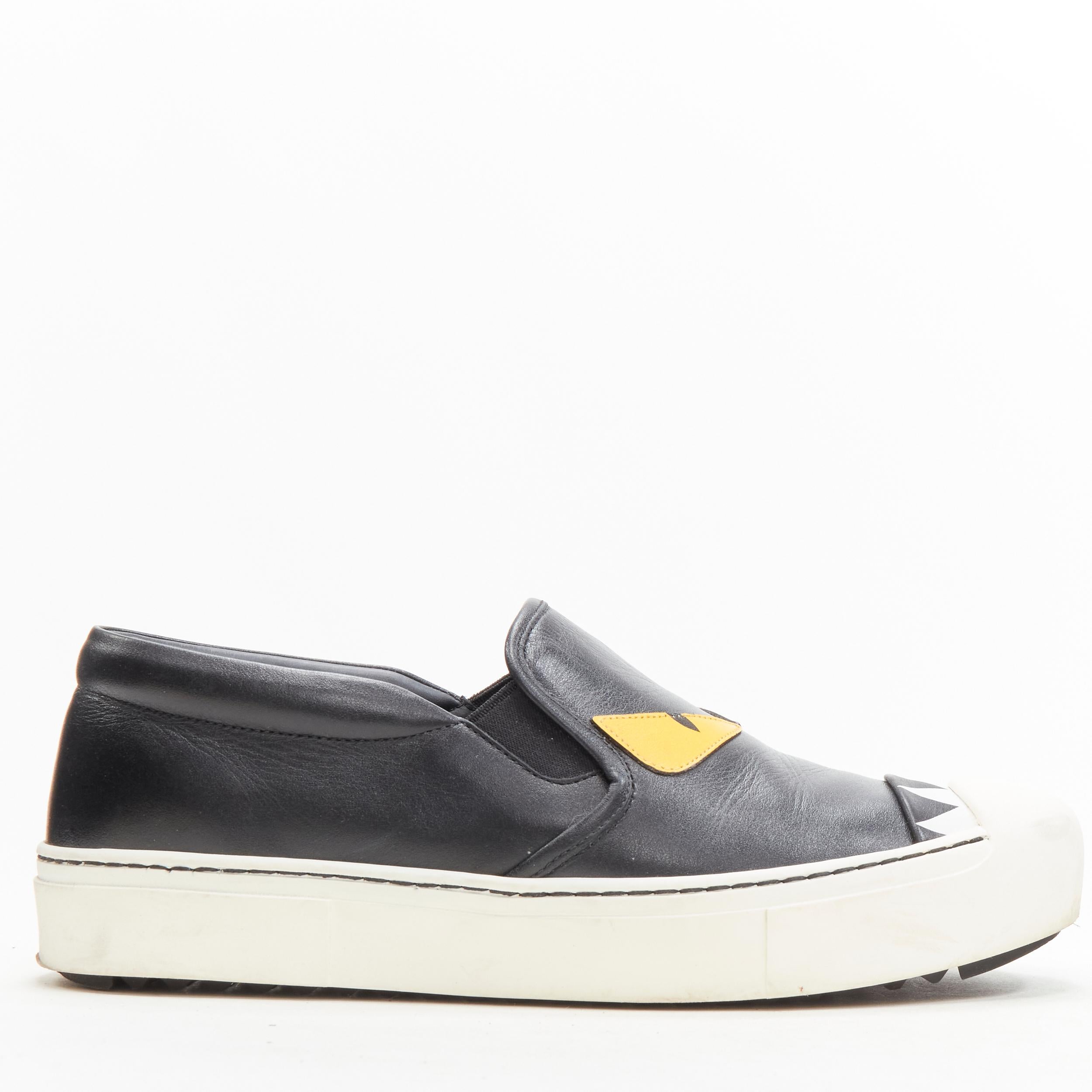 FENDI Monster Bug Eye black yellow leather slip on skate sneakers shoes EU36.5 
Reference: ANWU/A00344 
Brand: Fendi 
Collection: Monster Eye 
Material: Leather 
Color: Black 
Pattern: Solid 
Extra Detail: White rubber outsole with FENDI Roma logo