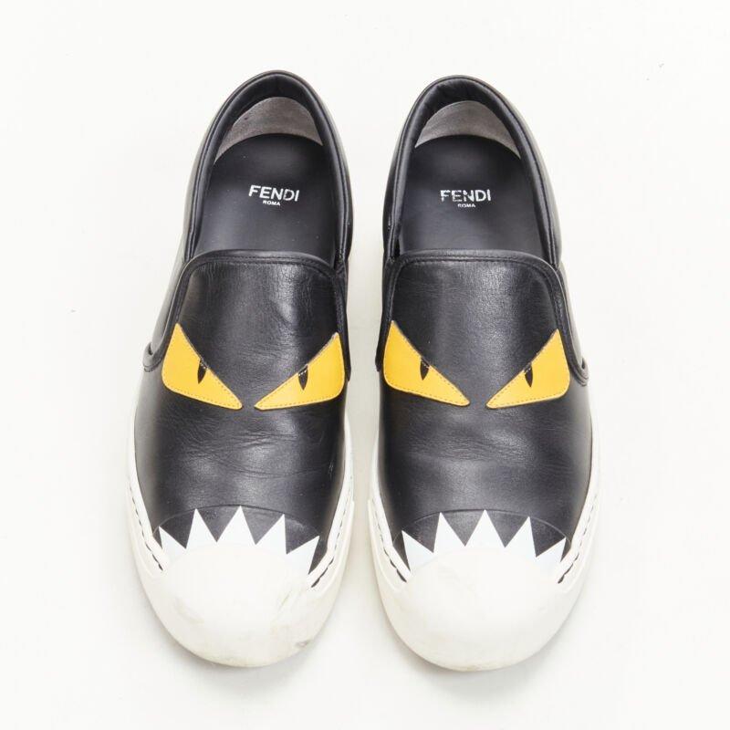 FENDI Monster Bug Eye black yellow leather slip on skate sneakers shoes EU36.5
Reference: ANWU/A00344
Brand: Fendi
Collection: Monster Bug
Material: Leather
Color: Black, Yellow
Pattern: Solid
Lining:  Leather
Extra Details: White rubber outsole.