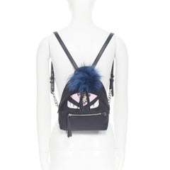 FENDI Monster Eyes Zaino fox fur trimmed chain linked black nylon small backpack