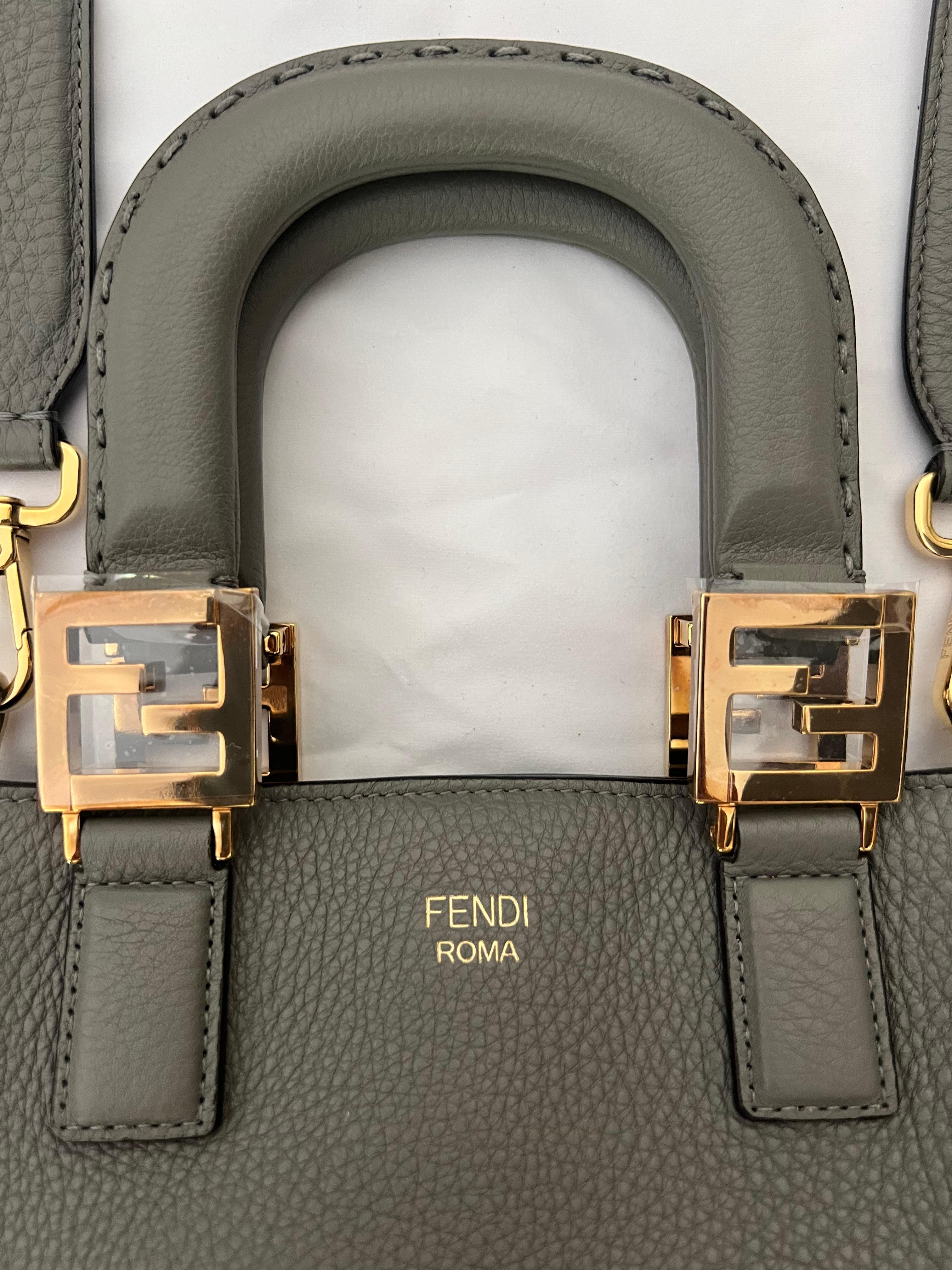 - Grained calfskin leather
- Gold tone hardware, some of it still has plastic protection attached 
- Removable and adjustable shoulder strap, drops 20”
- Double handles, drops, 5”
- Featuring logo hardware
- Logo and one interior pocket
- Magnetic