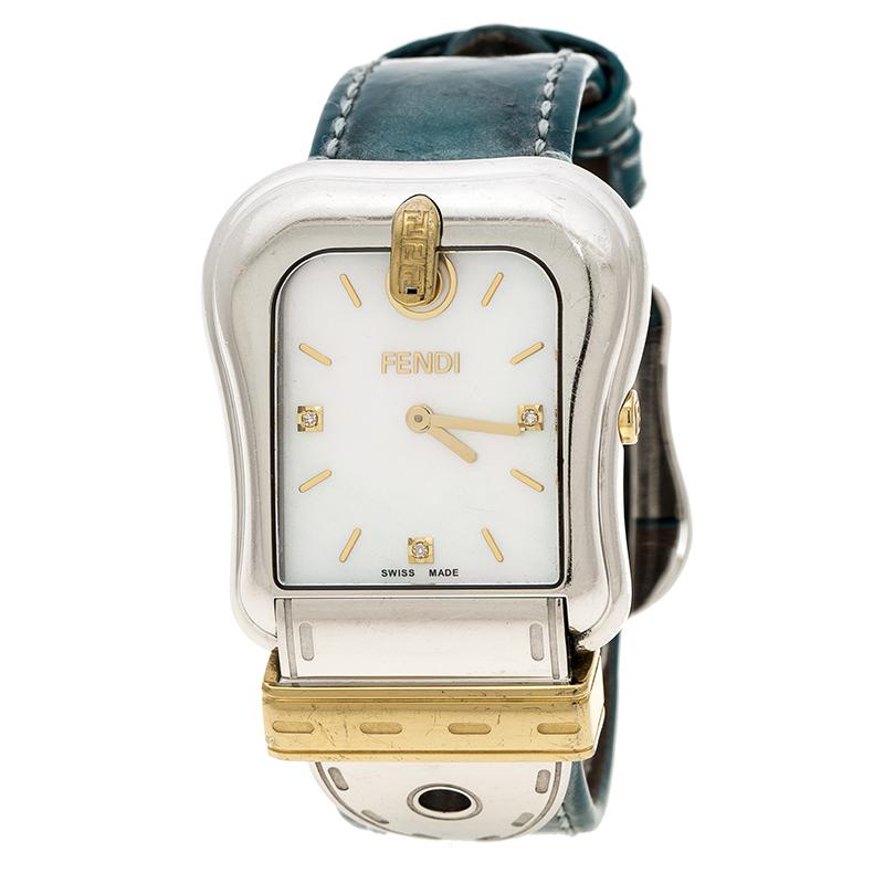 Fendi's B.Fendi style watch is a gorgeous creation from the house with a white stainless steel body and a case diameter of 33mm. It features a buckle-shaped, mother of pearl dial with gold-plated steel accents, diamond-embedded markers and gold-tone