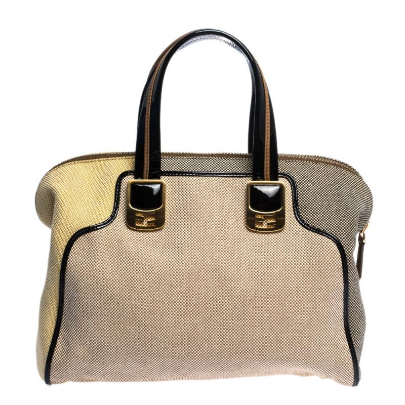 If trendy is your style, then look no further! This colour-block pattern, Fendi beauty is the ultimate blend of style and modern fashion. Made from jacquard and patented leather, it comes in a mix of brown, beige and gold, and also features metallic