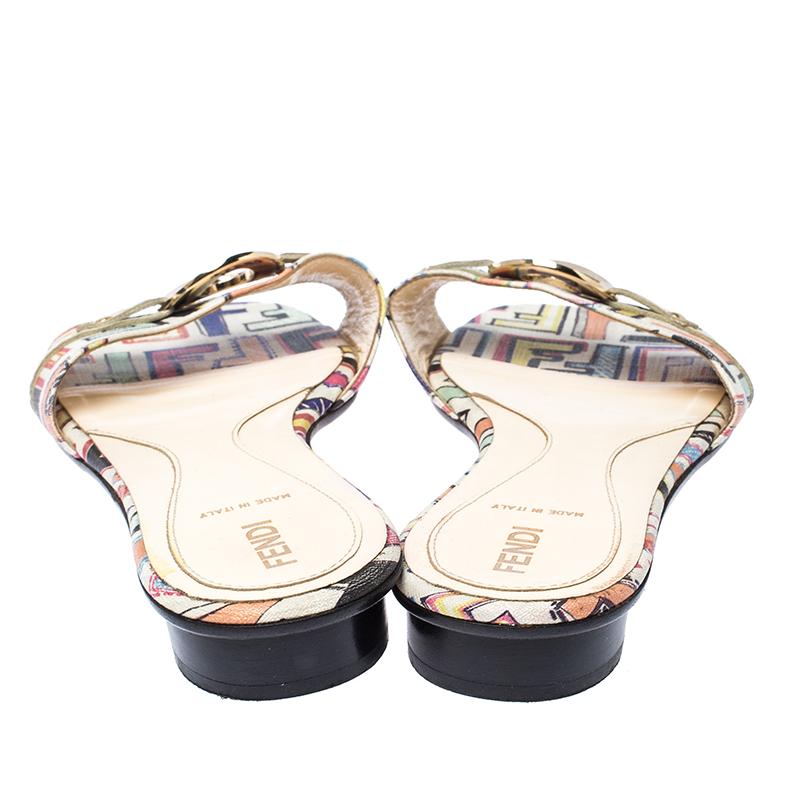 Comfort and style come together with these slide sandals from Fendi! The slides are designed with printed canvas and detailed with logo metal accents on the uppers. They are complete with leather insoles and are sure to make your feet very happy!

