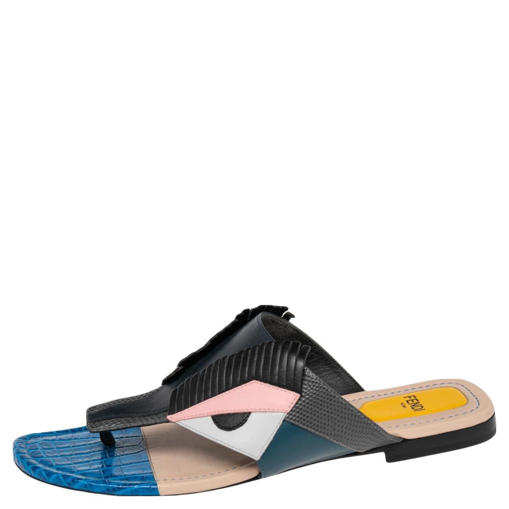 Give an edge to your outfit by stepping out in these thong sandals from the house of Fendi. Crafted from leather in Italy, this pair features a playful design and vibrant color blocks. The exterior gives off a quirky vibe, making it ideal for casual