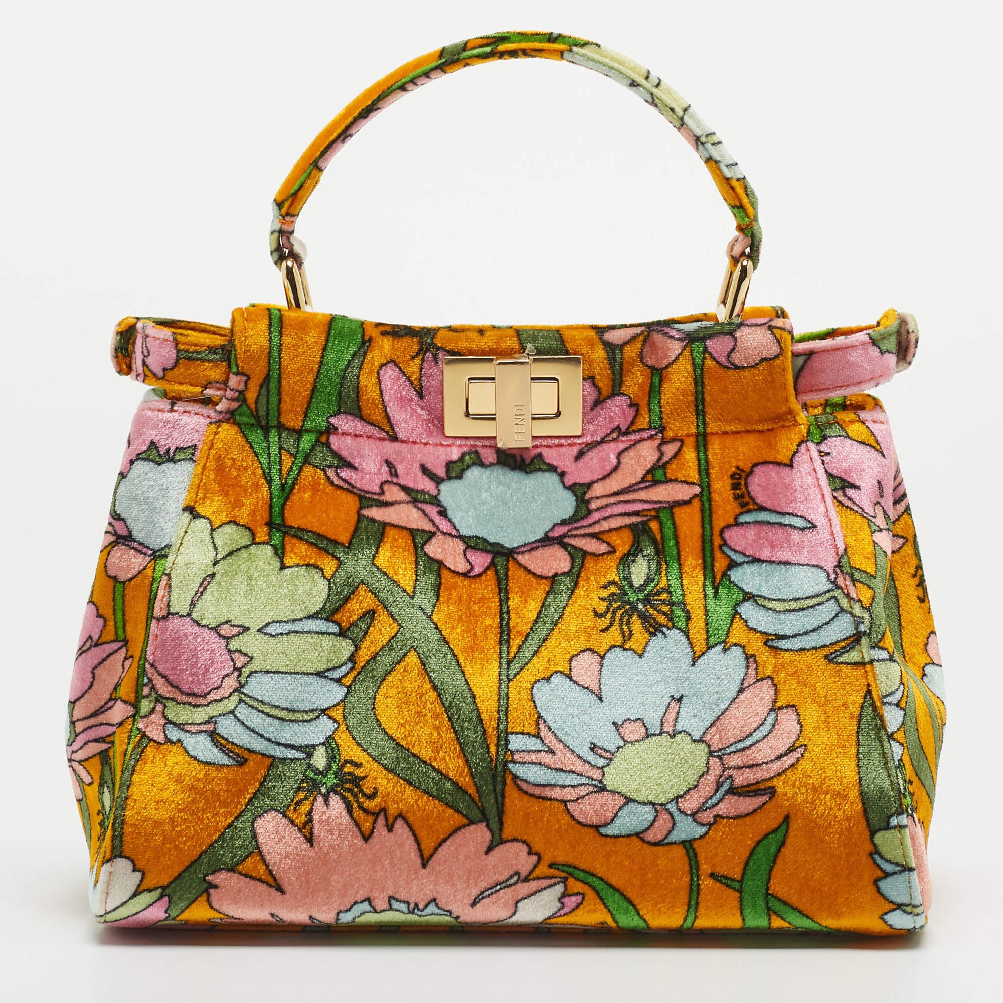 Designed by Venturini Fendi, the Peekaboo was first debuted in 2008. The unique construction and representation of this bag enable it to keep up with fashion's ever-changing tide. Constructed from floral printed velvet, it is complemented with