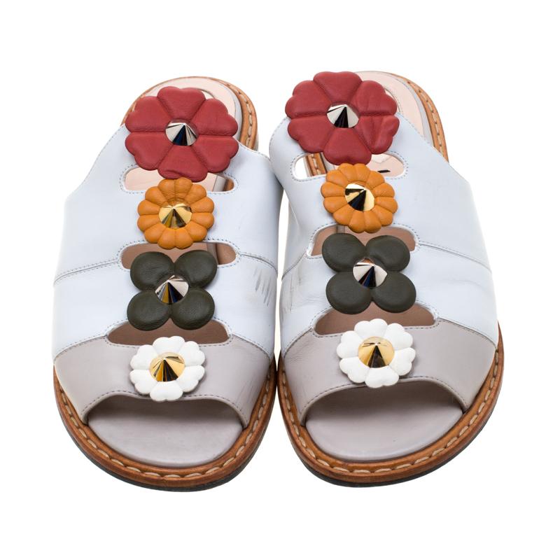 Exquisite and enchanting, these sandals from Fendi are worth every penny you spend! The slides are crafted from leather and feature an open toe silhouette. They've been embellished with colorful flower motifs on the uppers and equipped with