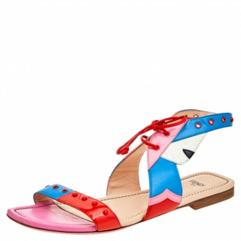 Your casual outfit will look more fun and colorful with these flat sandals from Fendi. They are made from multicolored leather and patent leather on the exterior and flaunt an ankle cuff feature, open-toes, and red-toned hardware. Chic and