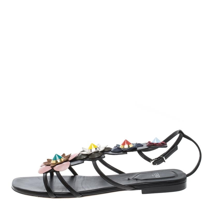 Fendi's embellished leather sandals are as sleek as they are quirky. Crafted in paneled, smooth black leather, the design is adorned in a multicoloured floral motif to the front for a feminine accent. Perfect to team up with vibrant summer dresses,