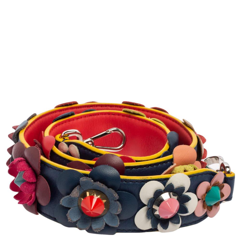 Fendi brings you this super-chic Strap You shoulder strap that you can flaunt with your vast collection of designer handbags. This strap is made from multicolored leather, with Flowerland appliques enriching its beauty. It is designed with dual