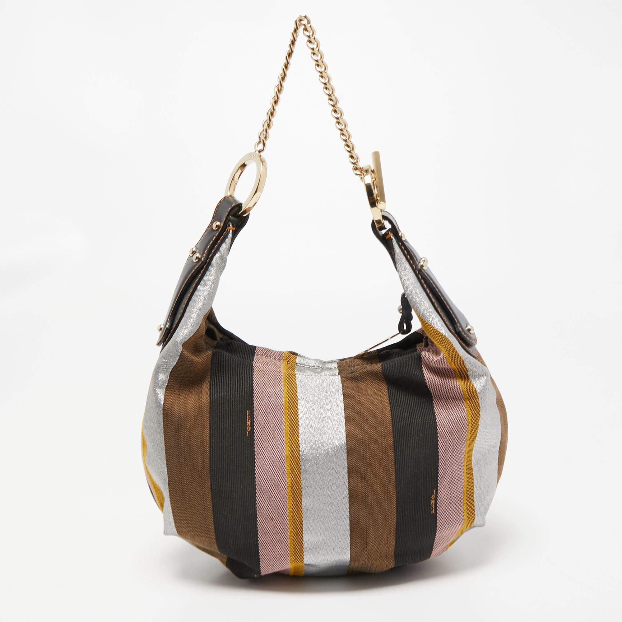 Stylish handbags never fail to make a fashionable impression. Make this designer hobo yours by pairing it with your sophisticated workwear as well as chic casual looks.

Includes: Original Dustbag

