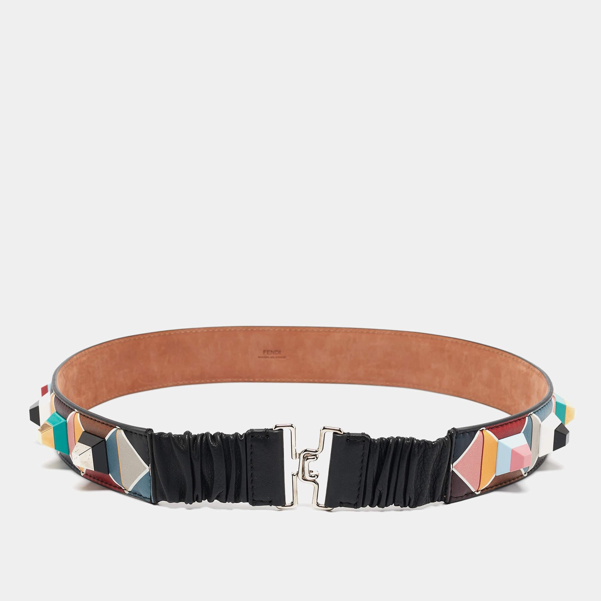 Embrace luxury with the Fendi belt. Crafted with precision, this accessory boasts a vibrant array of hues intricately printed on supple leather, accentuated by gleaming studs. Elevate any ensemble with its exquisite craftsmanship and timeless