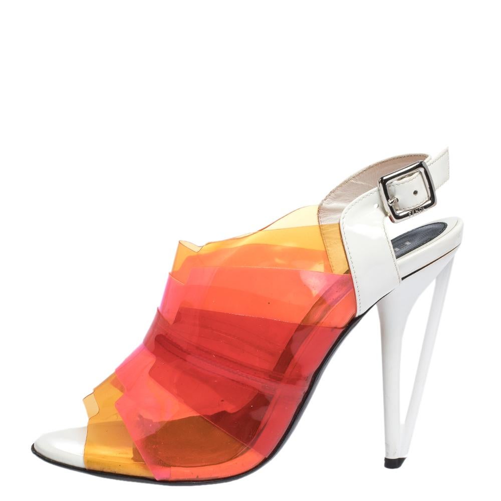 The house of Fendi brings you these impressive sandals that will add a pop of color to any ensemble. Crafetd from quality PVC and white patent leather. They are styled with open toes, buckled slingback, silver-tone hardware and 11 cm high heels.