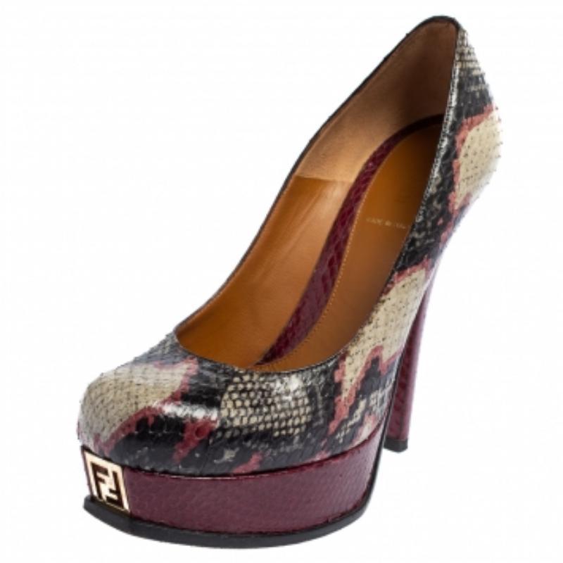 Luxury and style are what these Fendi pumps embody! Crafted from exotic python in a round toe silhouette, these sleek pumps are made with the utmost skills. Complete with the signature gold-tone 'F' details on the front toe base, these pumps are